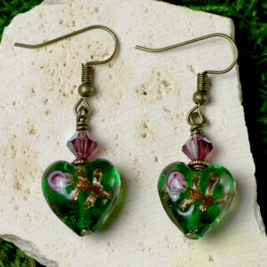 Earrings made from heart-shaped green glass beads.