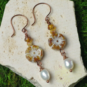 Earrings made with rustic flower beads and little pearls.