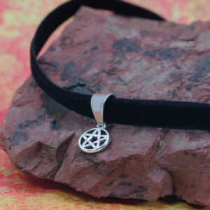 A black velvet choker with a pentagram charm.