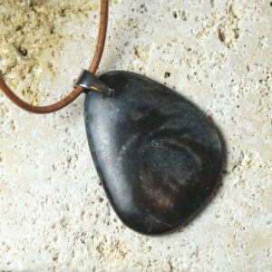 A marble pendant on a leather cord