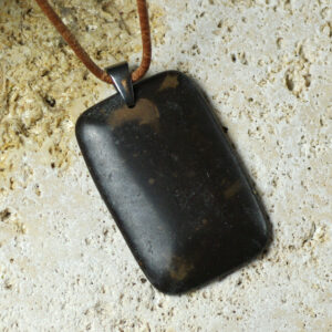 A marble pendant on a leather cord